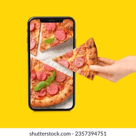 Creative collage with hand taking slice of tasty pizza and mobile phone on yellow background - Powered by Shutterstock