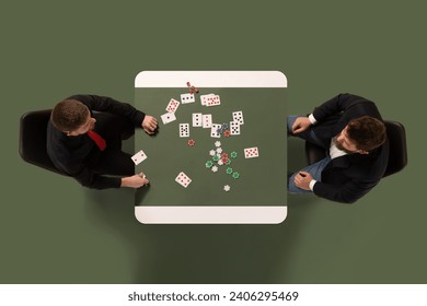 Creative collage. Top view of two rich man playing cards, gambling on table against green, khaki color background. Concept of casino, sport, gambling, risk, leisure. Copy space. Ad - Powered by Shutterstock