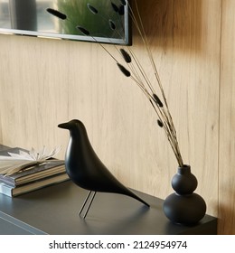 Creative composition of details of modern living room interior in small apartment Black commode, figure of black bird, tv and personal accessories. Template.