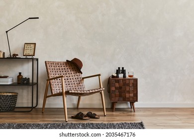 Creative Composition Of Elegant Masculine Living Room Interior With Copy Space, Brown Armchair, Designed Commode, Industrial Shelf And Personal Accessories. Template.  