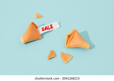 Creative composition with fortune cookie and paper with text on blue background