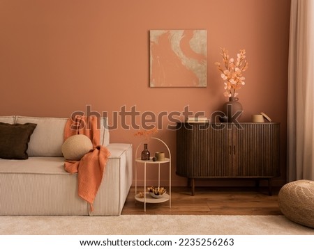 Creative composition of living room interior with mock up poster frame, wooden sideboard, modular beige sofa, brown pouf, plaid, pillows, rug, pink wall and personal accessories. Home decor. Template.