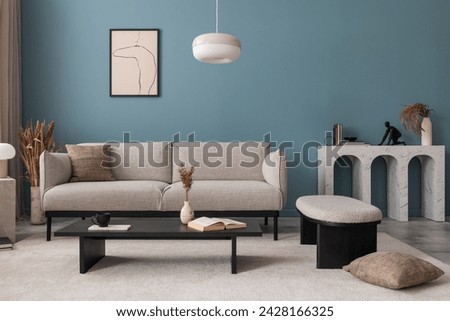 Creative composition of living room interior with mock up poster frame, grey sofa, black coffee table, blue wall, stylish furnitures, decorations and personal accessories. Template. Home decor.	