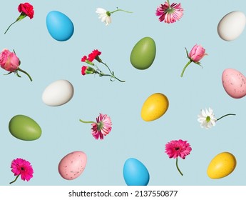 Creative composition made with colorful flowers and Easter eggs on sky blue background. Spring holidays concept. - Powered by Shutterstock