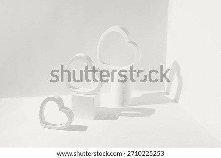 Creative composition made of heart shaped figures and geometric podiums. Valentine day and romance concept. Minimal style. Color of the year 2026 inspired