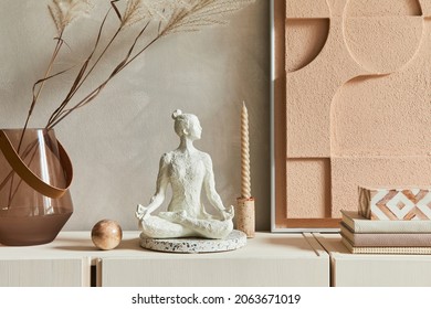 Creative composition of modern beige living room interior design with designed sculpture, structure painting, beige wooden sideboard and boho inspired personal accessories. Template.