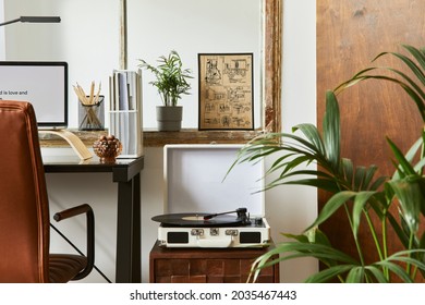 Creative Composition Of Modern Masculine Home Office Workspace Interior With Black Industrial Desk, Brown Leather Armchair, Laptop, Vintage Record Player And Stylish Personal Accessories. Template.