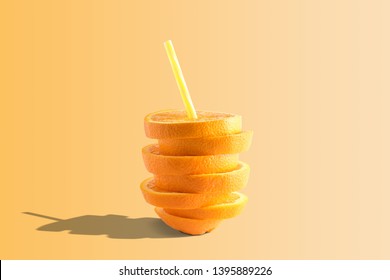 Creative Composition With Orange Juice And Straw On Bright Background. Minimal Fruit Concept.