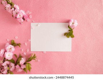 Creative composition of pink flowers and pink background. Flowerscape flat lay. Copy space