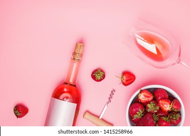 Creative Composition With Rose Wine And Delicious Strawberries On The Pink Background, Top View