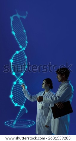 Creative composition. Scientists exploring holographic dna spiral glowing in blue digital projection. Concept of genetics, biotechnology, medical education, and futuristic healthcare innovation.