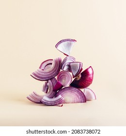 Creative composition of sliced red onion on earthy beige background. Equilibrium floating food balance. Healthy eating and vegetarian concept. - Shutterstock ID 2083738072