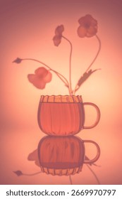 creative composition still life with transparent mug and tea, with flower in fog, concept summer, spring, bloom, tenderness, birthday card, holiday, pink