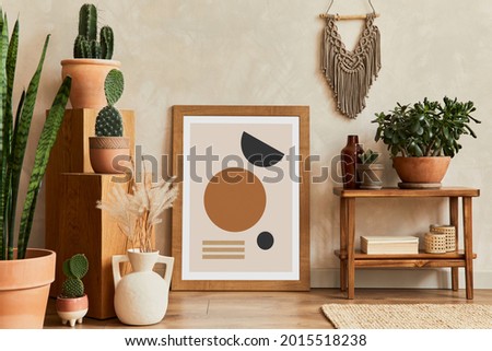 Creative composition of stylish living room interior with mock up poster frame, wooden shelf, cacti and personal accessories. Plant love and nature concept. Template.