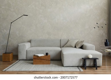 Creative Composition Of Stylish Modern Spacious Living Room With Grey Sofa, Wooden Cubes, Pillows, Plaid, Carpet, White Vases And Small Personal Accesories. Parquet Floor. Copy Space. Template.