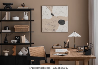 Creative composition of warm and cozy office interior with mock up poster frame, wooden desk, rattan chair, stylish lamp, black rack, books and office accessories. Home decor. Template. - Powered by Shutterstock