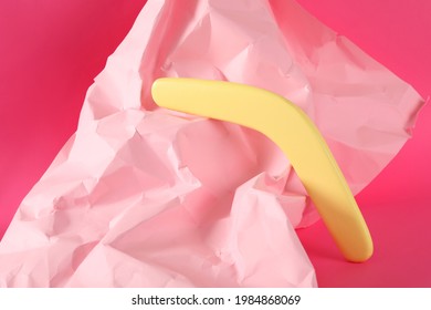 Creative Composition With Yellow Wooden Boomerang On Pink Background