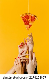 Creative concept advertising fast food. Hands reach for a piece of pizza. - Shutterstock ID 2178251957