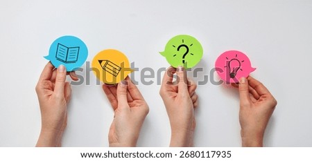 A creative concept of education and learning. Speech bubbles contain symbols of a book, a pencil, a question mark, and a light bulb, which represent learning, questions, ideas, and new knowledge.