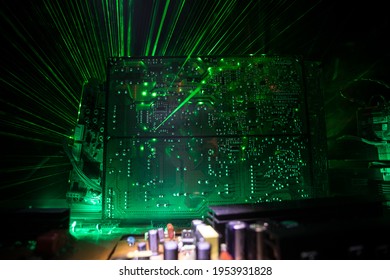 Creative concept of modern technology, inside an electronic device. Electronic circuit board close up in low key. Selective focus