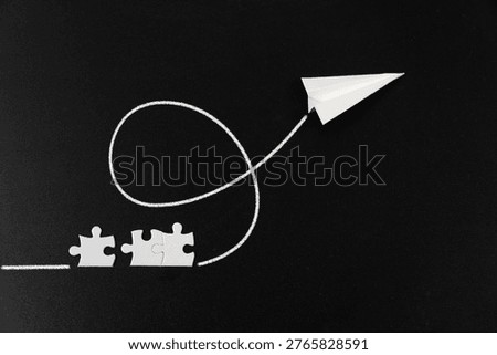 Creative concept of a paper plane launching from puzzle pieces on a dark background, symbolizing problem solving, progress, innovation, and turning ideas into action.