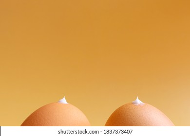 Creative concept of products for the health of the female breast, nipples. Brown eggs 