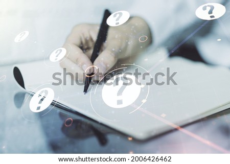 Creative concept of question mark illustration and man hand writing in notebook on background. FAQ and search concept. Multiexposure