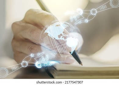 Creative concept of robotics technology with globe sketch and woman hand writing in notebook on background. Robot development and automation concept. Multiexposure