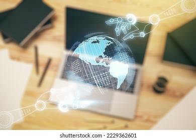 Creative concept of robotics technology with globe sketch on modern laptop background. Robot development and automation concept. Multiexposure