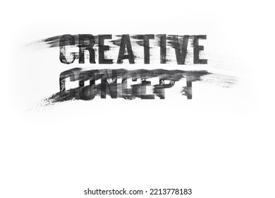 Creative Concept Words In Capital Letters Written With Black Ink Stamp Letters, And Smudged Across White Glossy Paper. Close Up Texture