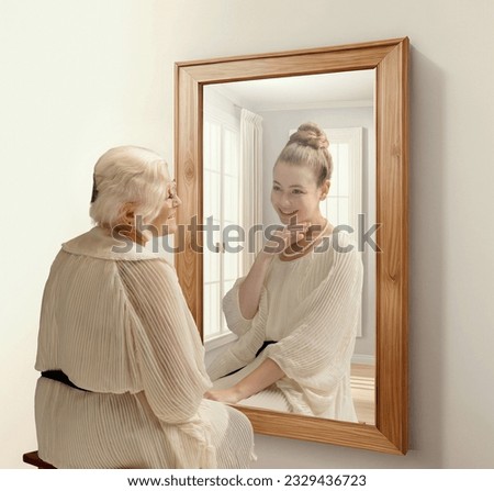 Creative conceptual collage. Smiling senior woman looking in mirror and remembering her past. Young girl in reflection. Concept of present, past and future, age, lifestyle, memories, generation, ad