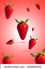 Creative Conceptual  Fresh Strawberries Explosion With Red Background 