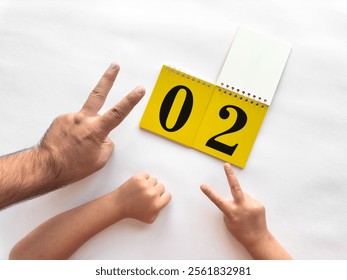 Creative countdown with hands and calendar on white background