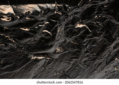 Creative Dark Background. Oil Production Concept. Crude Oil Close Up