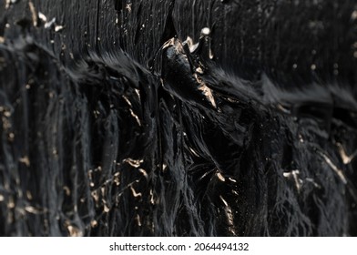 Creative Dark Background. Oil Production Concept. Crude Oil Close Up