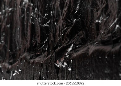 Creative Dark Background. Oil Production Concept. Crude Oil Close Up	