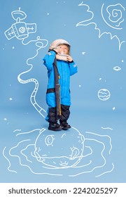 Creative design with drawn elements. Portrait of little boy, child in costume of astronaut over blue background. Future profession. Concept of imagination, childhood, creativity, dreams, ad