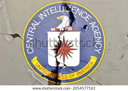 Creative design Seal of the Central Intelligence Agency isolated on weathered broken wall with cracks background