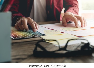 Creative designer working at office. Creating new mobile web design, Designer's desk with responsive web design concept.