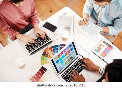 Creative, designers and meeting with color swatches above for web, interior design or project at office. Top view, employees or team planning with laptop, tablet or technology for colorful palette - Powered by Shutterstock