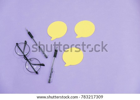 Creative Desk on pink glasses notepad kicking pencils plant macaroons alarm clock Top View