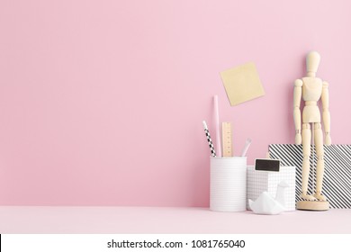 Creative Desk With Pink Wall.