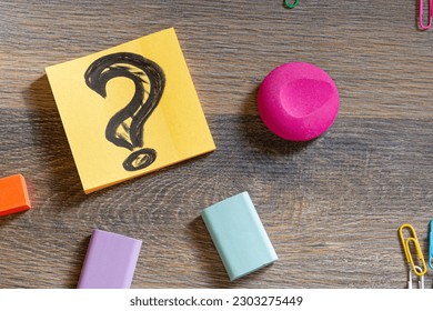 Creative desktop with idea concept and question mark on paper sheet