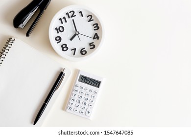 Creative desktop. Modern design, white colors. Office, school ,college . Alarm clock and school, college, business object. Copy space. - Powered by Shutterstock