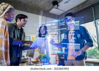 Creative digital development agency and Augmented Reality concept.businessman use VR Glasses(Virtual Reality Headset) for ux developer and ui designer about mobile app interface at modern office.