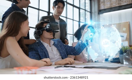 Creative digital development agency and Augmented Reality concept.businessman use VR Glasses(Virtual Reality Headset) for ux developer and ui designer about mobile app interface at modern office. - Powered by Shutterstock