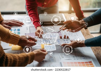 Creative digital development agency.  developer team brainstorming on their project with laptop, smartphone and digital tablet.