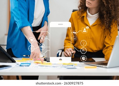 Creative digital development agency. developer team brainstorming on project with laptop, smartphone and digital tablet.