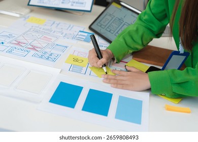Creative digital development agency. developer team brainstorming on their project with laptop, smartphone and digital tablet.	