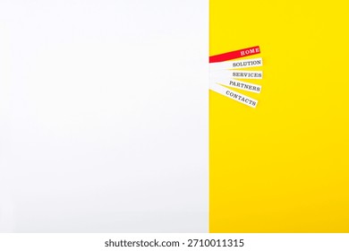 Creative display of business navigation tabs on yellow background showcasing home, solution, services, partners, and contacts